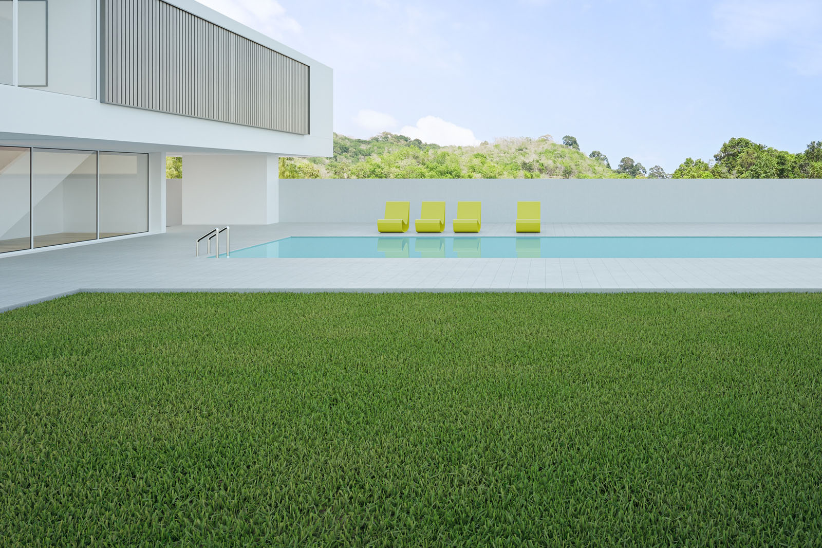 Modern DFW backyard with artificial turf and pool deck featuring clean lines, bright lounge chairs, and a resort-style design.