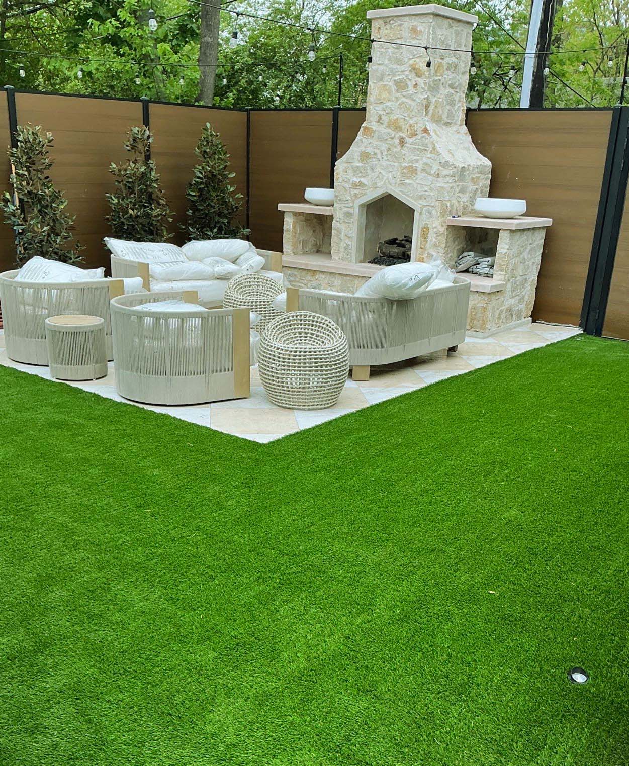 Artificial turf backyard with outdoor seating area in North Texas
